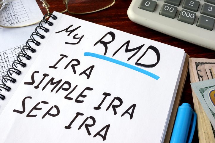 My RMD (Required Minimum Distributions) IRA, SIMPLE IRA, SEP IRA written in a notebook.